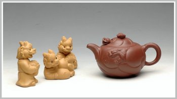 紫砂壶图片：一朝鲤鱼跃龙门   优质底料 做工细腻 精品小鱼化龙 - 宜兴紫砂壶网