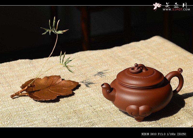 紫砂壶图片：沉稳大气 精美之作 动感十足  吉祥如意 - 宜兴紫砂壶网