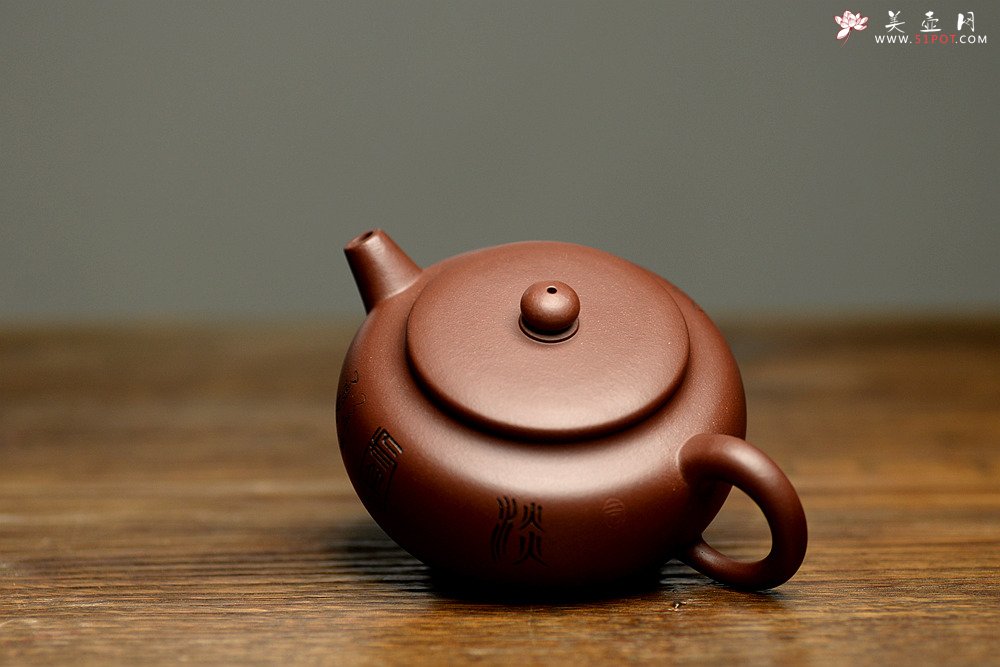 紫砂壶图片：实用佳器 秀气可爱 扁拙 - 宜兴紫砂壶网