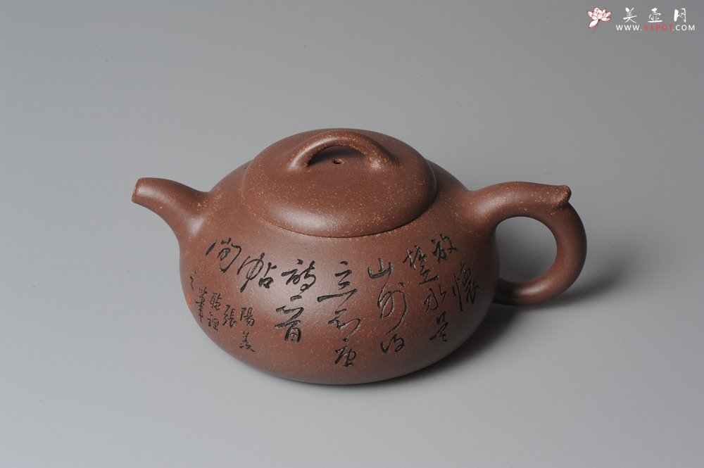 紫砂壶图片：文气装饰 饱满敦厚 扁腹 - 宜兴紫砂壶网