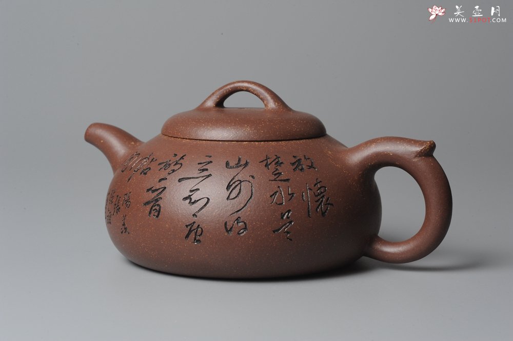 紫砂壶图片：文气装饰 饱满敦厚 扁腹 - 宜兴紫砂壶网