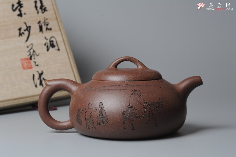 紫砂壶图片：文气装饰 饱满敦厚 扁腹 - 宜兴紫砂壶网