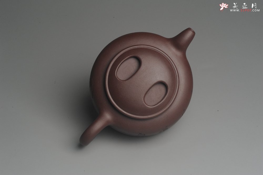 紫砂壶图片：美壶特惠 潜力股助工精工老紫泥牛盖壶 罗汉图 - 宜兴紫砂壶网