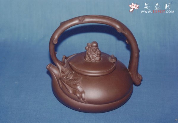 紫砂壶图片：寿星提梁壶 - 宜兴紫砂壶网